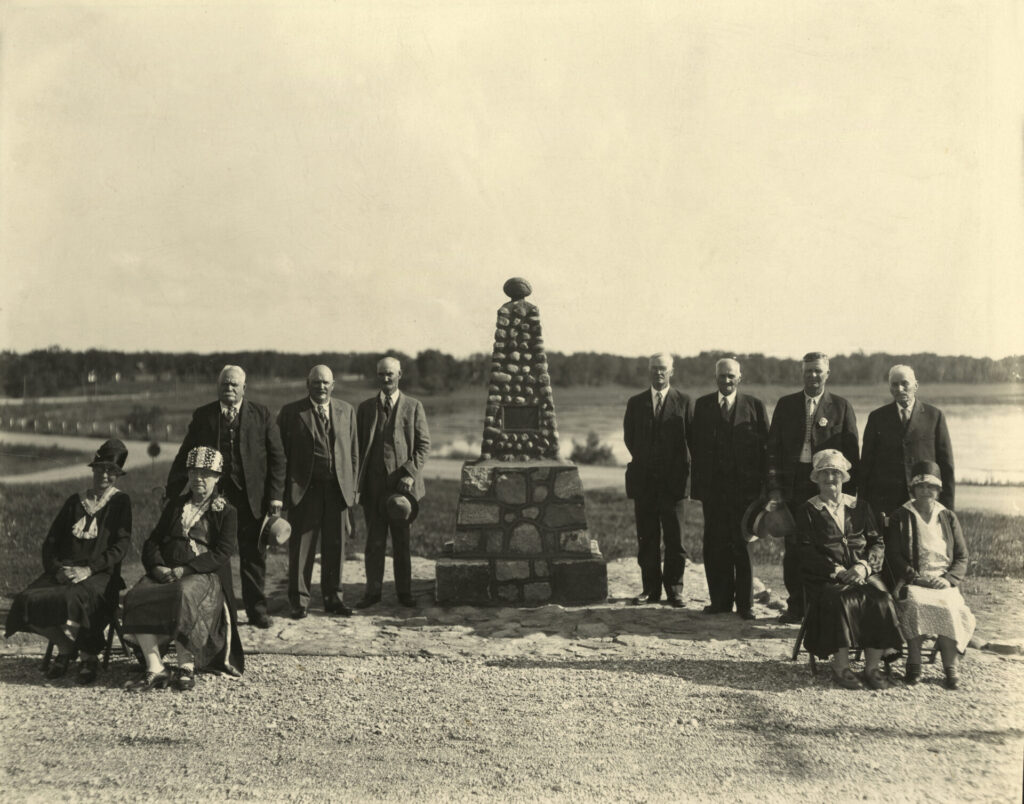 Parkers Prairie Historical Monument Dedication, June 29, 1930 [dedicated
by Otter Tail County Historical Society]
Standing (l to r): Johannes Peterson, Willis A. Smith, Hugh Hall, Frank A.
Saunders, Peter Lindall, J.W. Hazen, Andrew Hanson
Seated (l to r): Mrs. John Algot (Swenson) Peterson, Lillian Saunders Terry,
Seated on right (l to r): Mrs. George Grotey, Minnie Nelson Bergquist