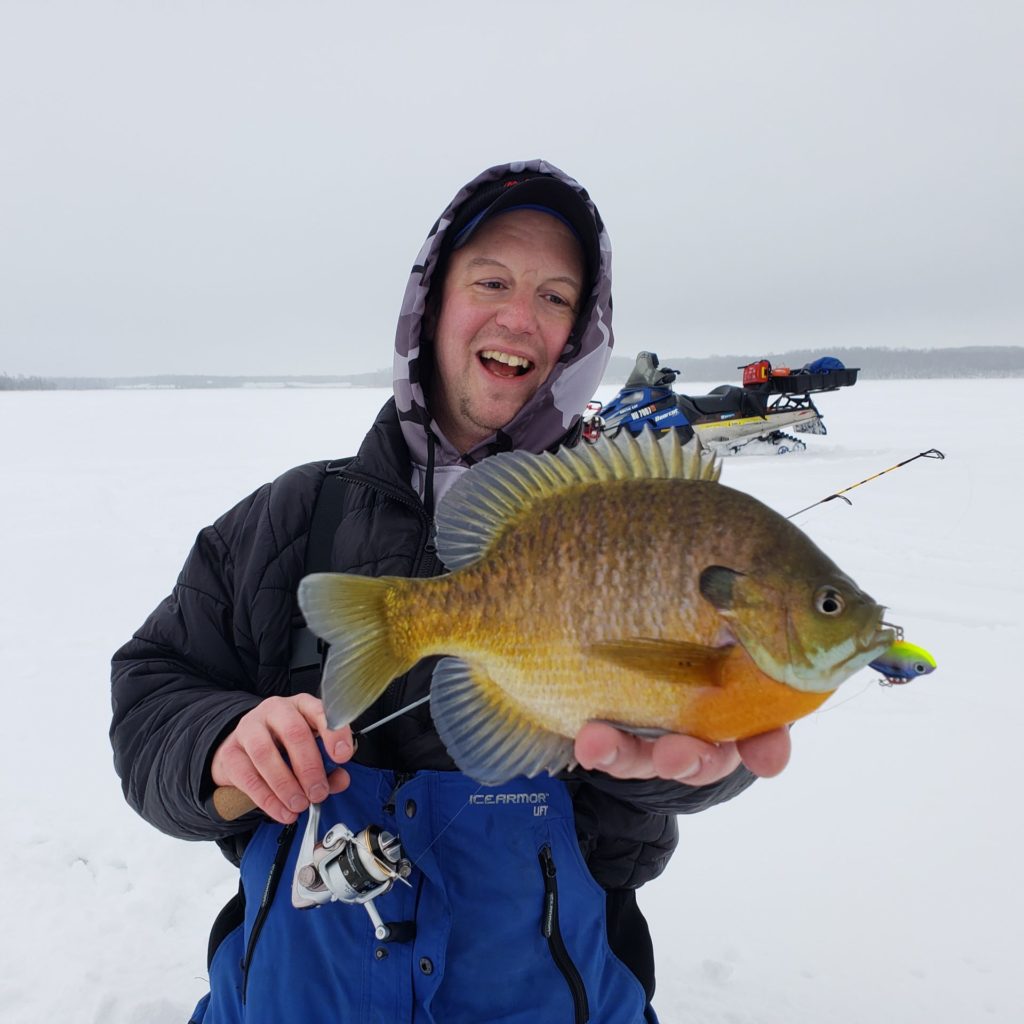guy caught fish on ice
