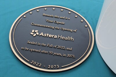 Tri-County Health Care lowers time capsule for new building