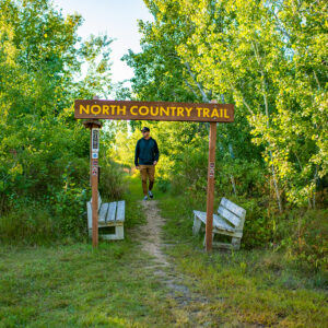 man walking North Country Scenic Hiking Trail