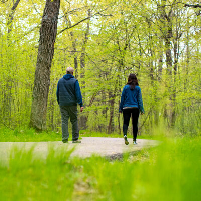 couple hiking on path