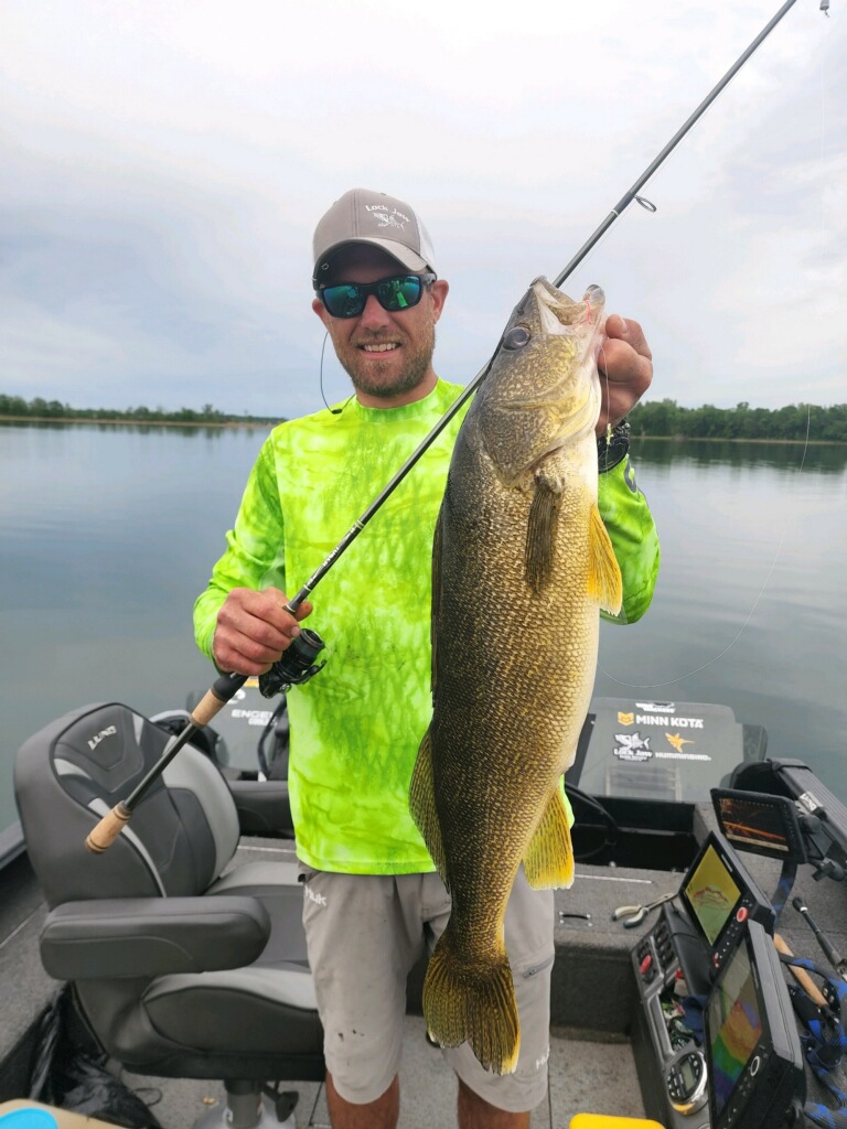 Randin Olson with a behemoth of a Walleye.