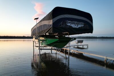boat lift on a lake with the sun setting