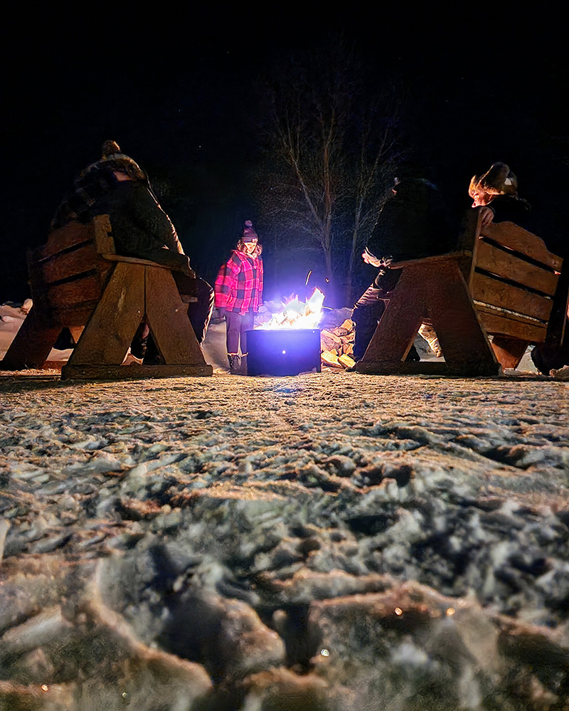 People around a winter campfire